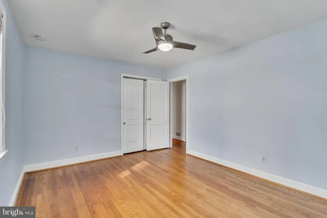 a view of an empty room and wooden floor