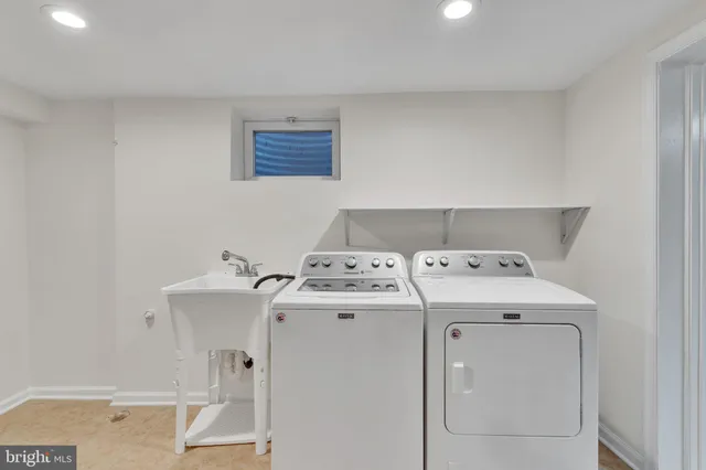 a utility room with dryer and washer