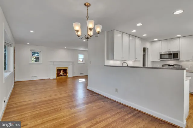 a view of a kitchen with microwave and cabinets