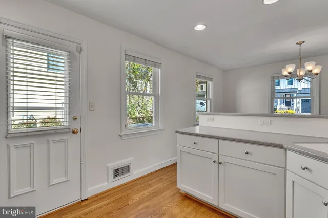a view of a kitchen cabinets and window