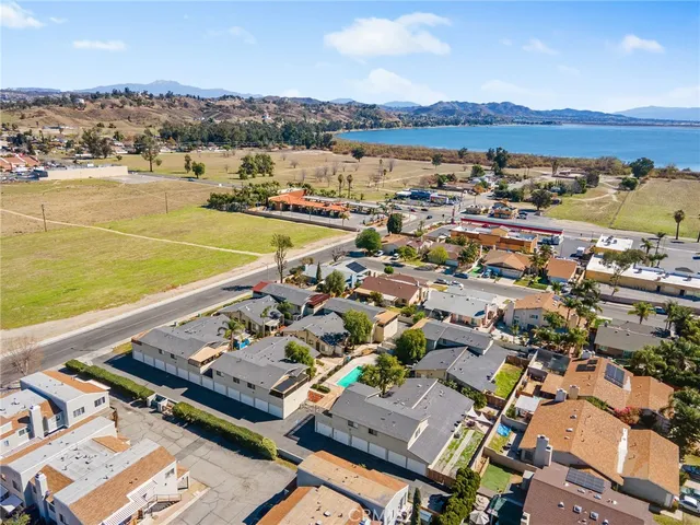an aerial view of residential houses with outdoor space