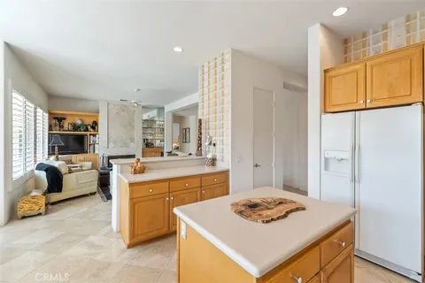 a kitchen that has a table and chairs in it