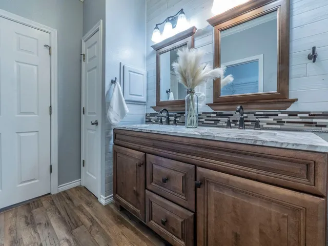 a bathroom with a sink and a mirror