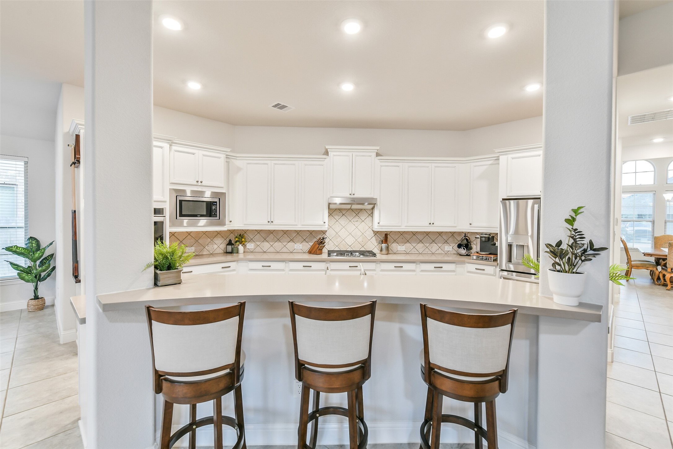 19206 Chestnut Colt Trail Tomball, TX 77377 - Photo 10 of 50 a kitchen with appliances cabinets and chair