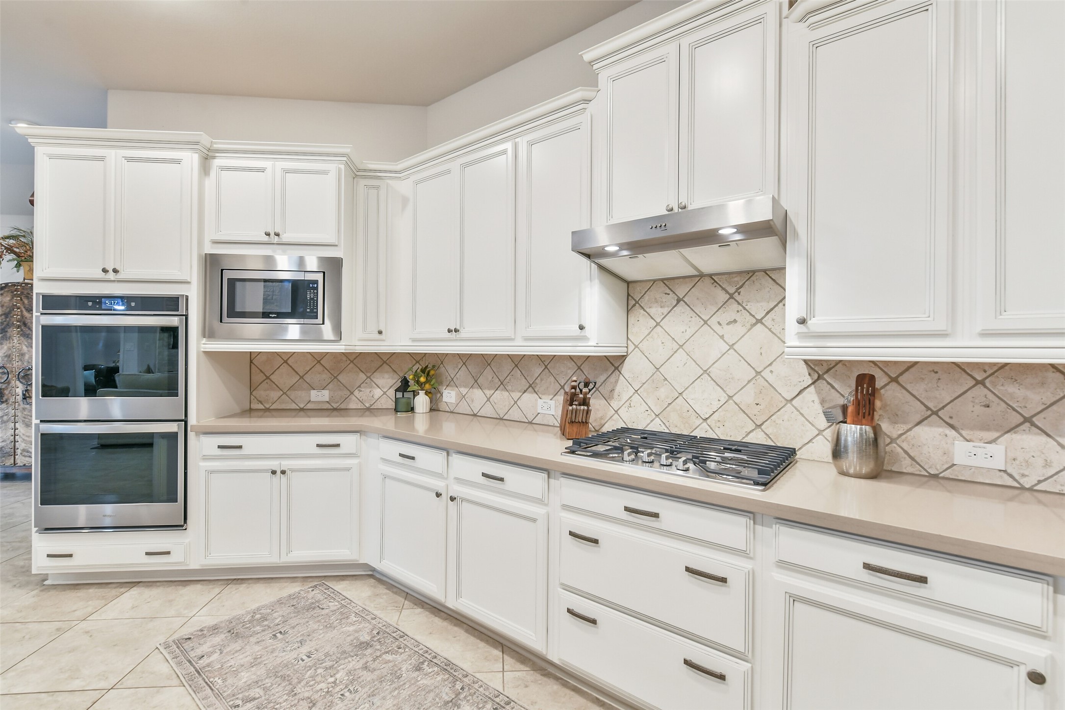 19206 Chestnut Colt Trail Tomball, TX 77377 - Photo 13 of 50 a kitchen with granite countertop white cabinets and stainless steel appliances