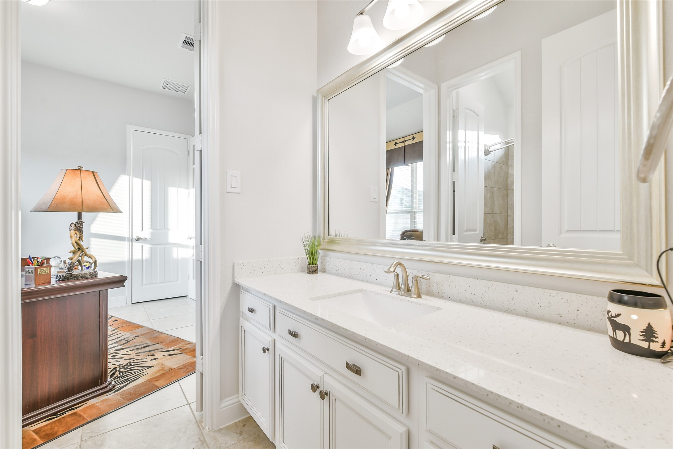 19206 Chestnut Colt Trail Tomball, TX 77377 - Photo 29 of 50 a bathroom with a sink and a mirror