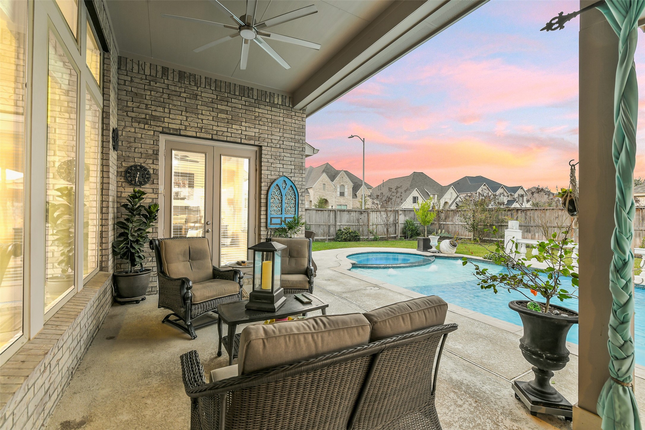 19206 Chestnut Colt Trail Tomball, TX 77377 - Photo 35 of 50 a living room with patio furniture and a floor to ceiling window