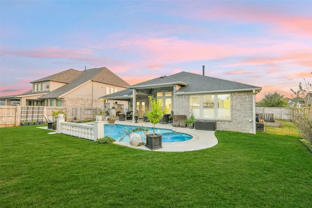 a front view of a house with a yard table and chairs