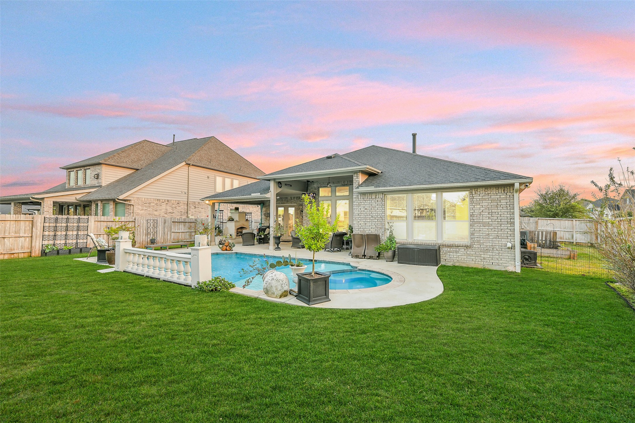 19206 Chestnut Colt Trail Tomball, TX 77377 - Photo 39 of 50 a front view of a house with swimming pool having outdoor seating