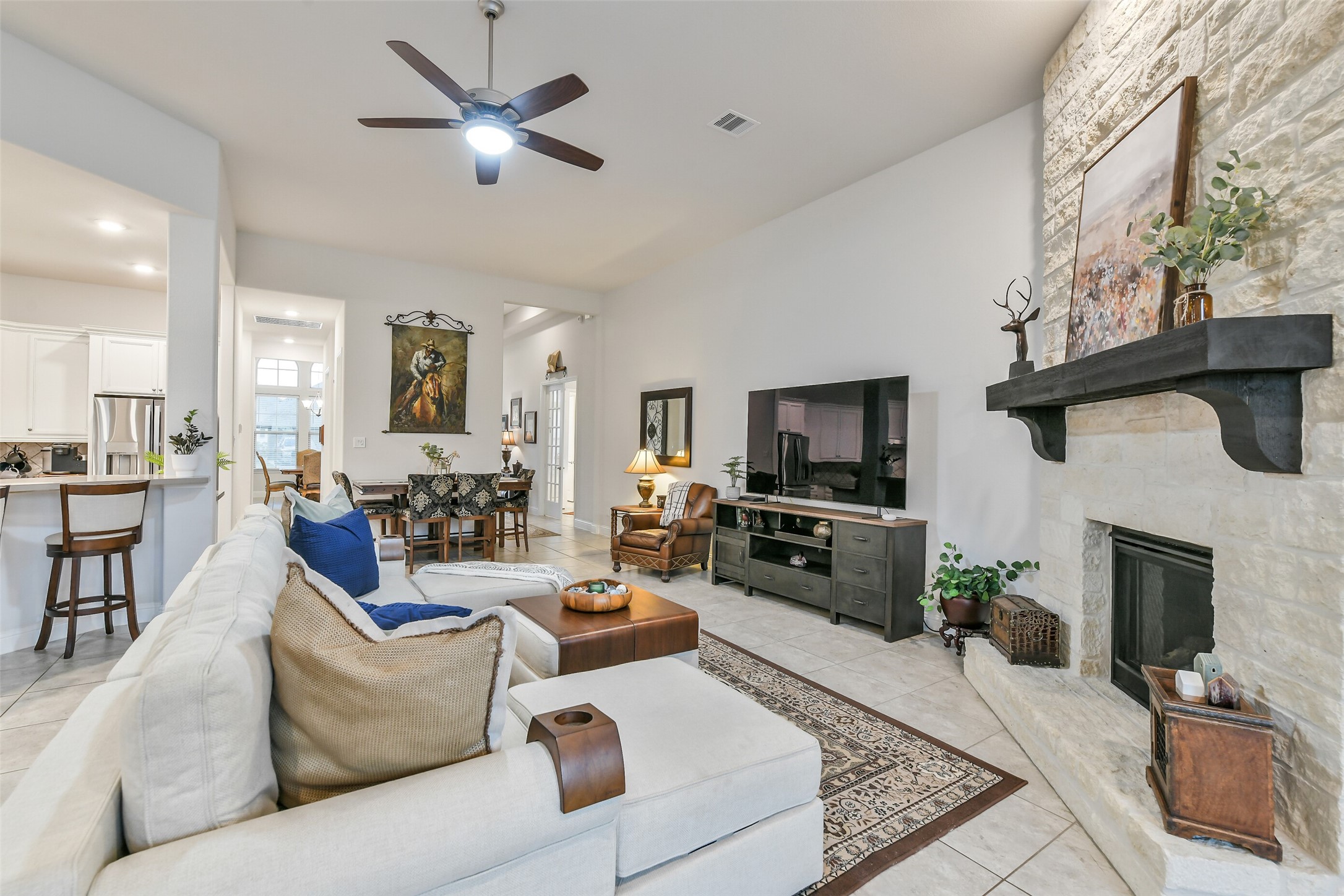 19206 Chestnut Colt Trail Tomball, TX 77377 - Photo 49 of 50 a living room with furniture a flat screen tv and a fireplace