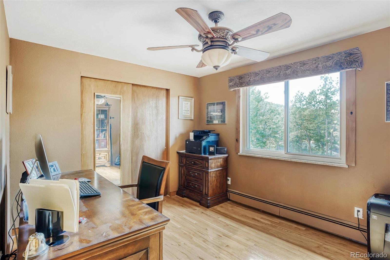 3518 South Saddle Road Evergreen, CO 80439 - Photo 11 of 27 a living room with furniture and a window