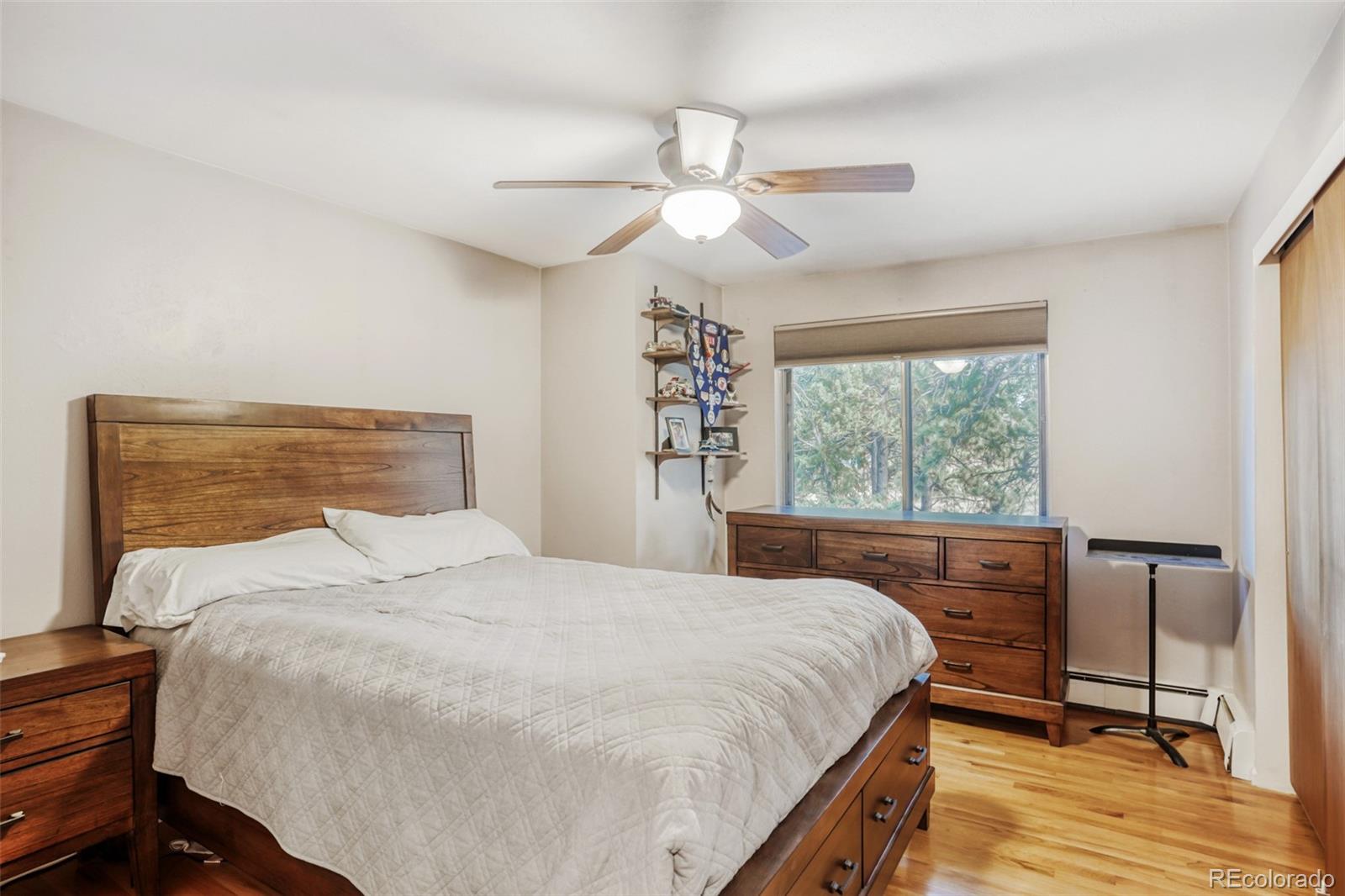 3518 South Saddle Road Evergreen, CO 80439 - Photo 12 of 27 a bedroom with a large bed and a large window