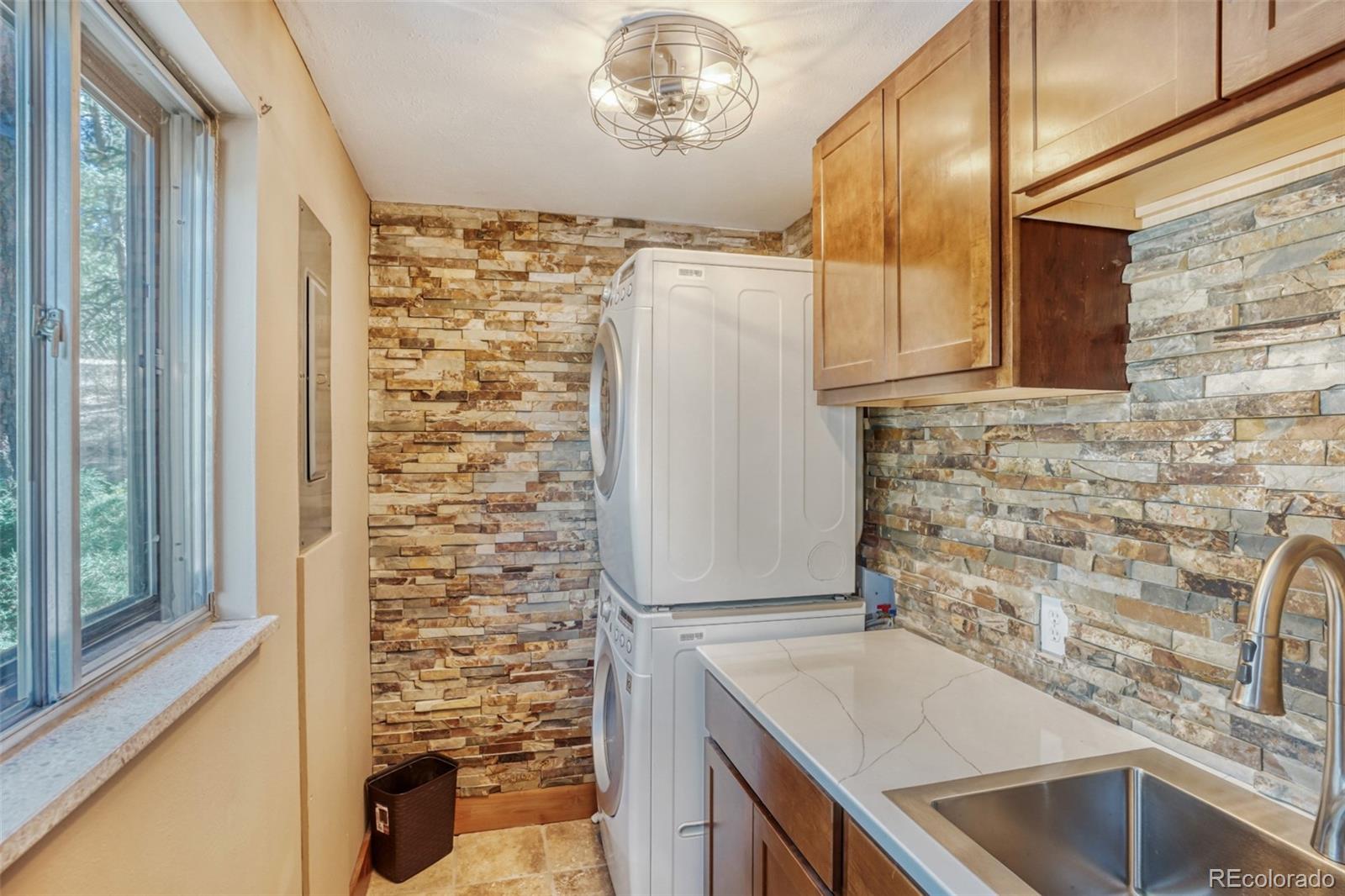 3518 South Saddle Road Evergreen, CO 80439 - Photo 16 of 27 a bathroom with a sink and a mirror