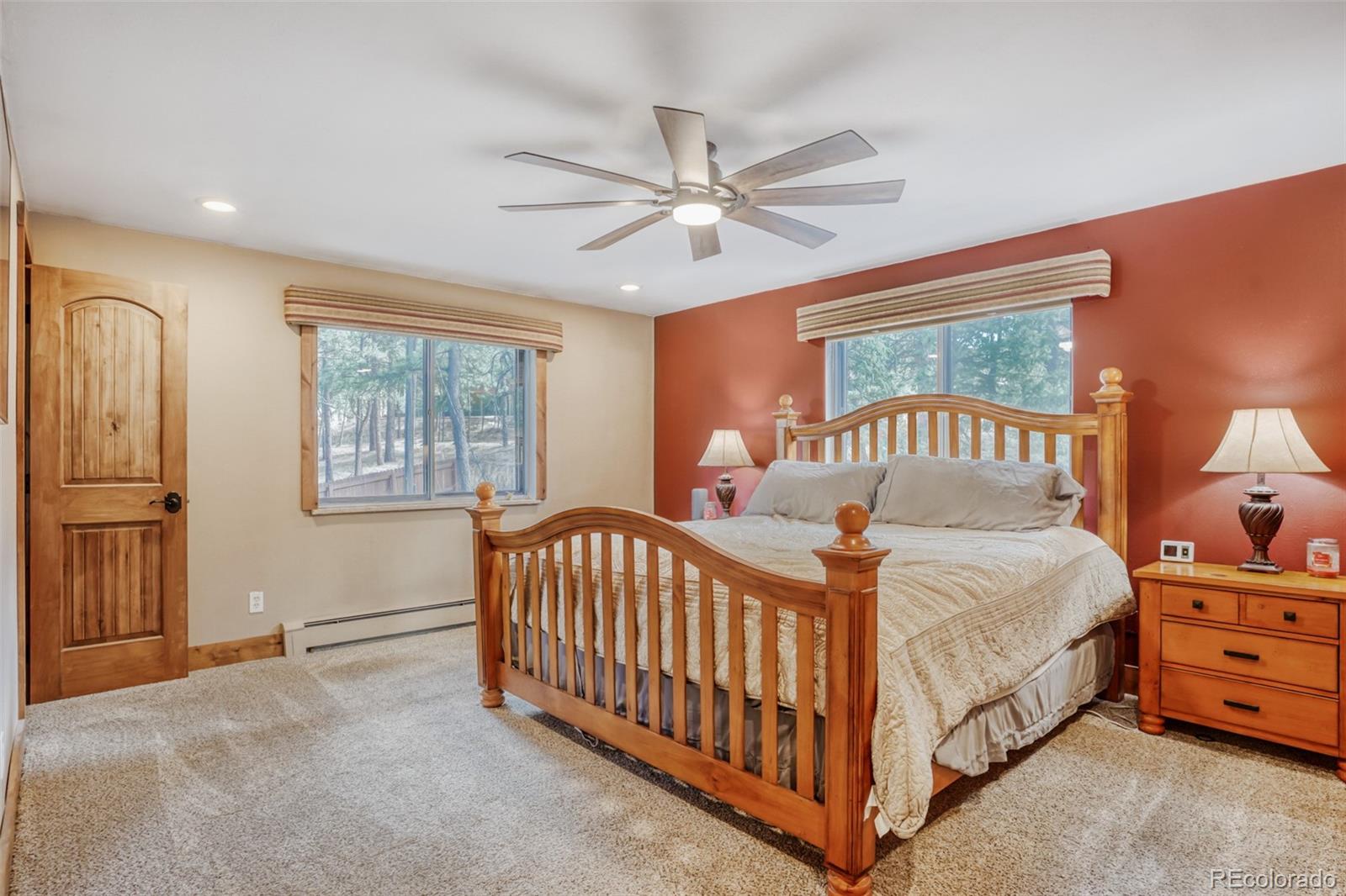 3518 South Saddle Road Evergreen, CO 80439 - Photo 8 of 27 a bedroom with a bed and a window