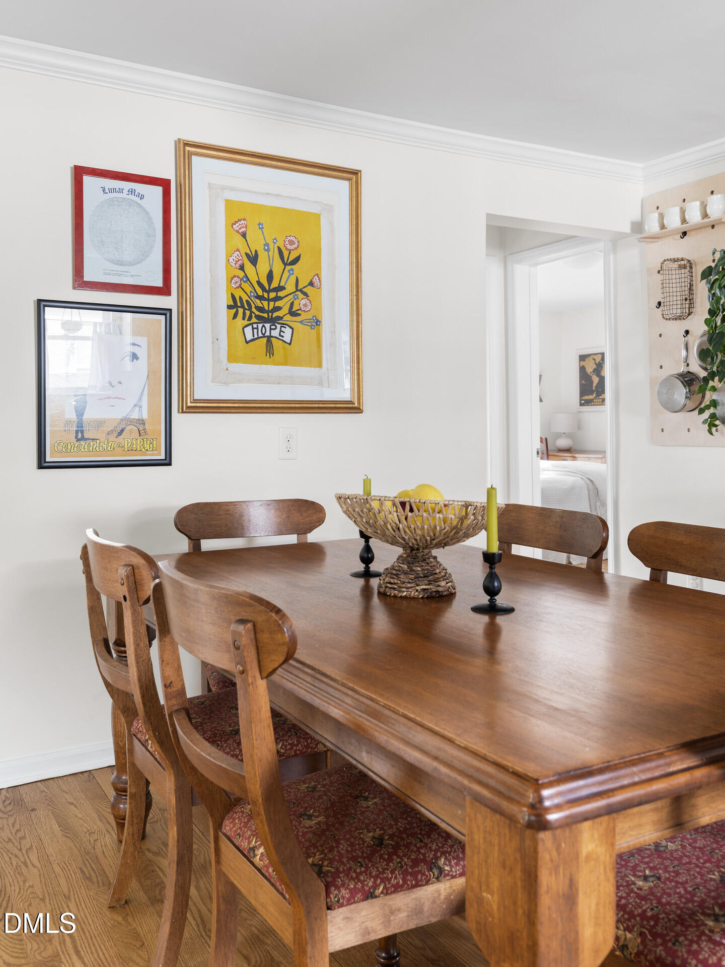 608 Canal Street Durham, NC 27701 - Photo 17 of 36 a living room with dining table and paintings on the wall with wooden floor