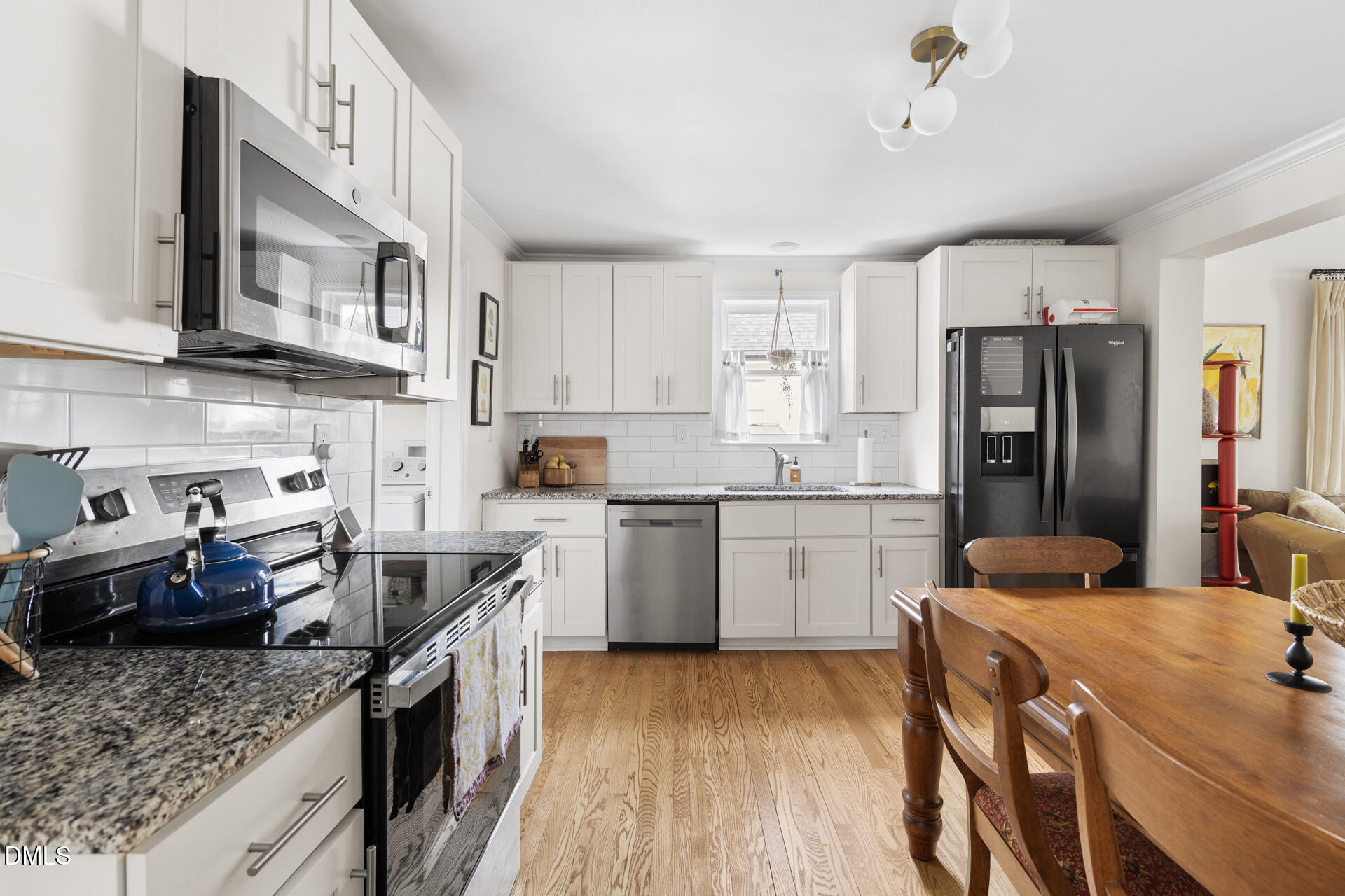608 Canal Street Durham, NC 27701 - Photo 19 of 36 a kitchen with a sink stove and refrigerator