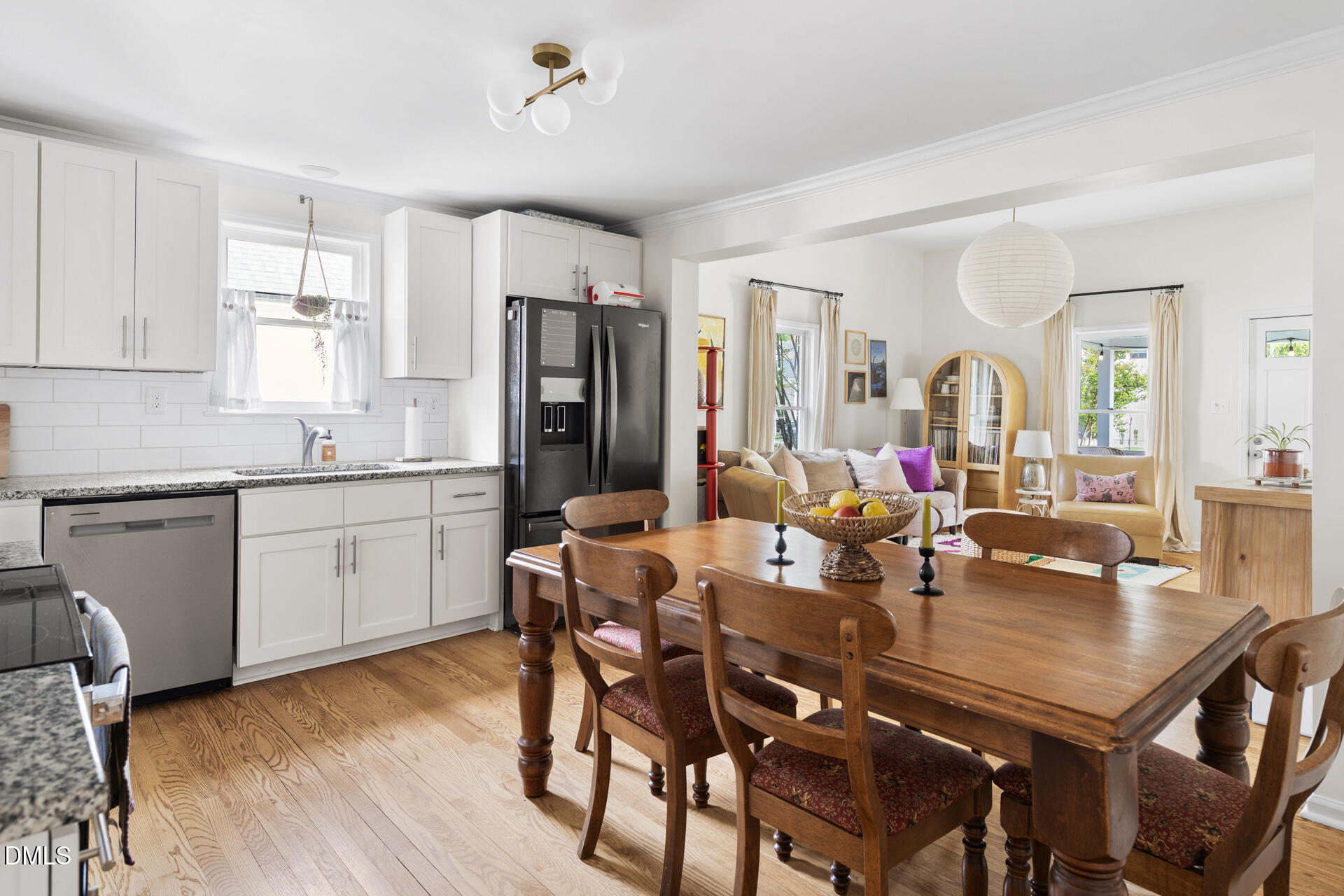 608 Canal Street Durham, NC 27701 - Photo 20 of 36 a view of a dining room with furniture and wooden floor