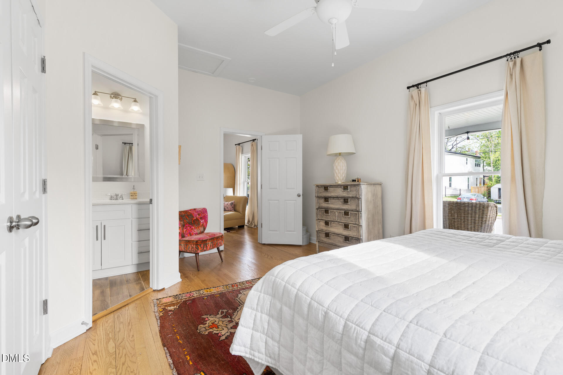 608 Canal Street Durham, NC 27701 - Photo 23 of 36 a spacious bedroom with a bed and a dresser