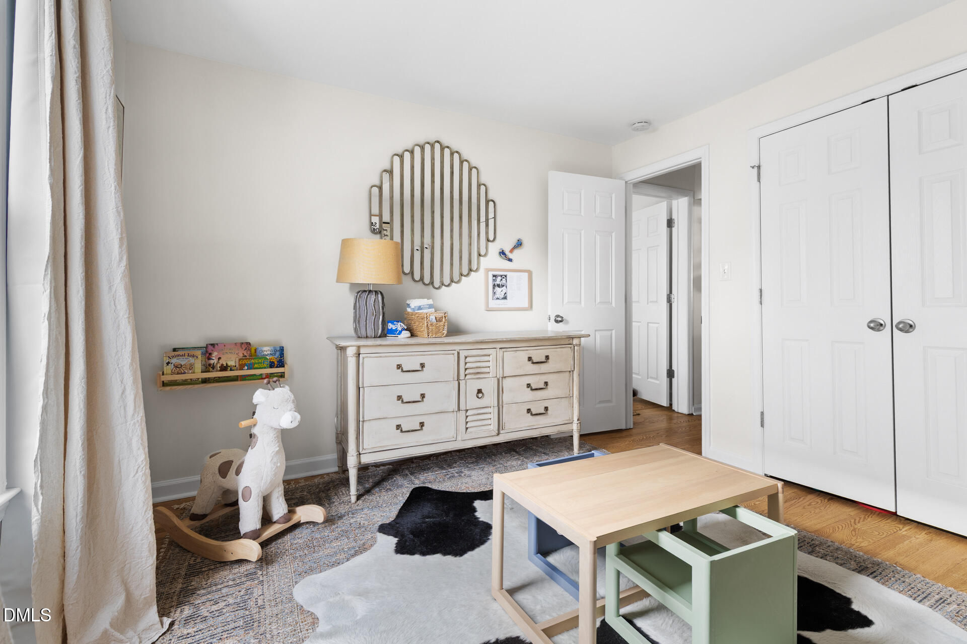 608 Canal Street Durham, NC 27701 - Photo 27 of 36 a room with furniture a rug and a window