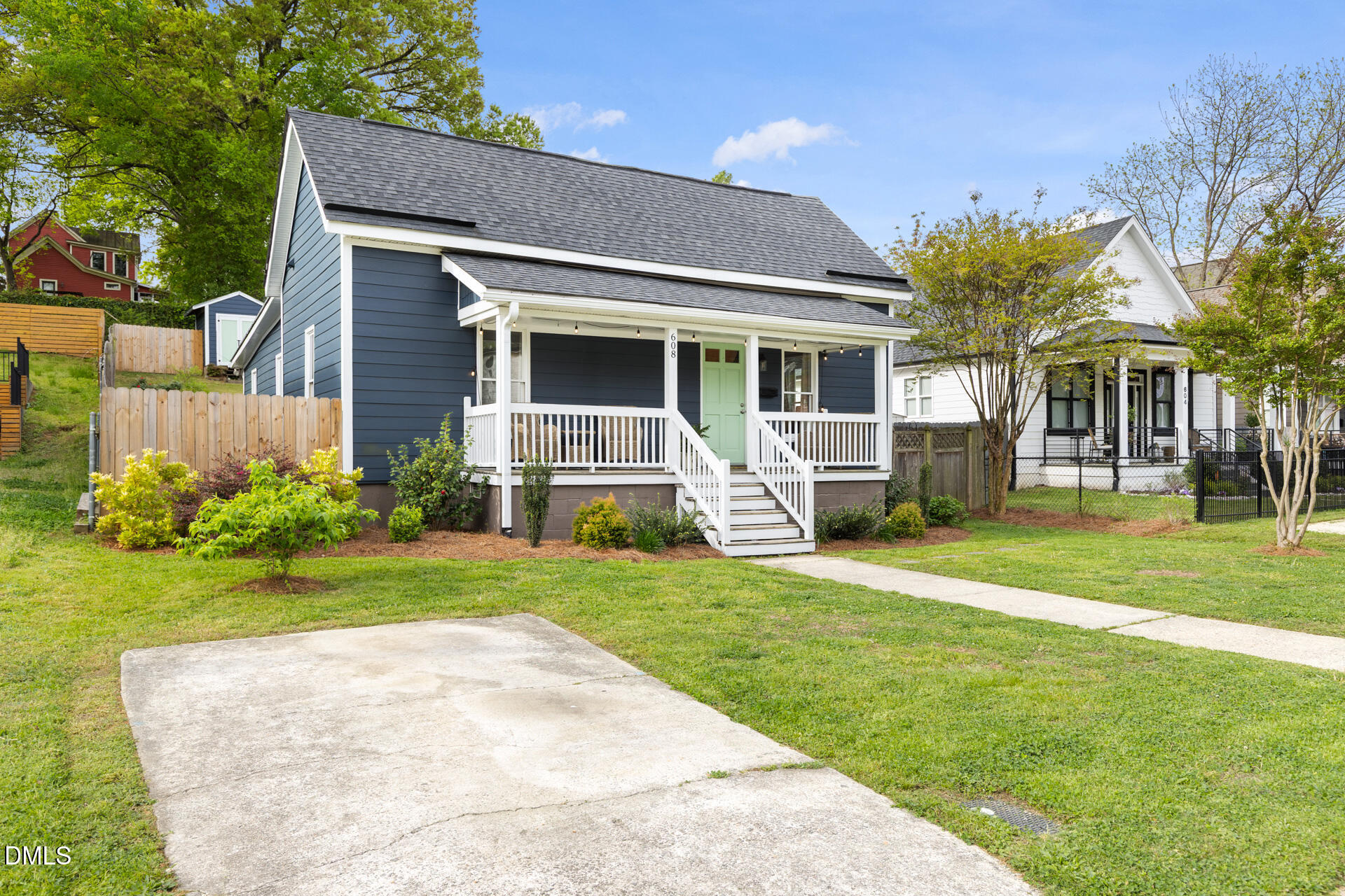 608 Canal Street Durham, NC 27701 - Photo 8 of 36 a front view of a house with a garden