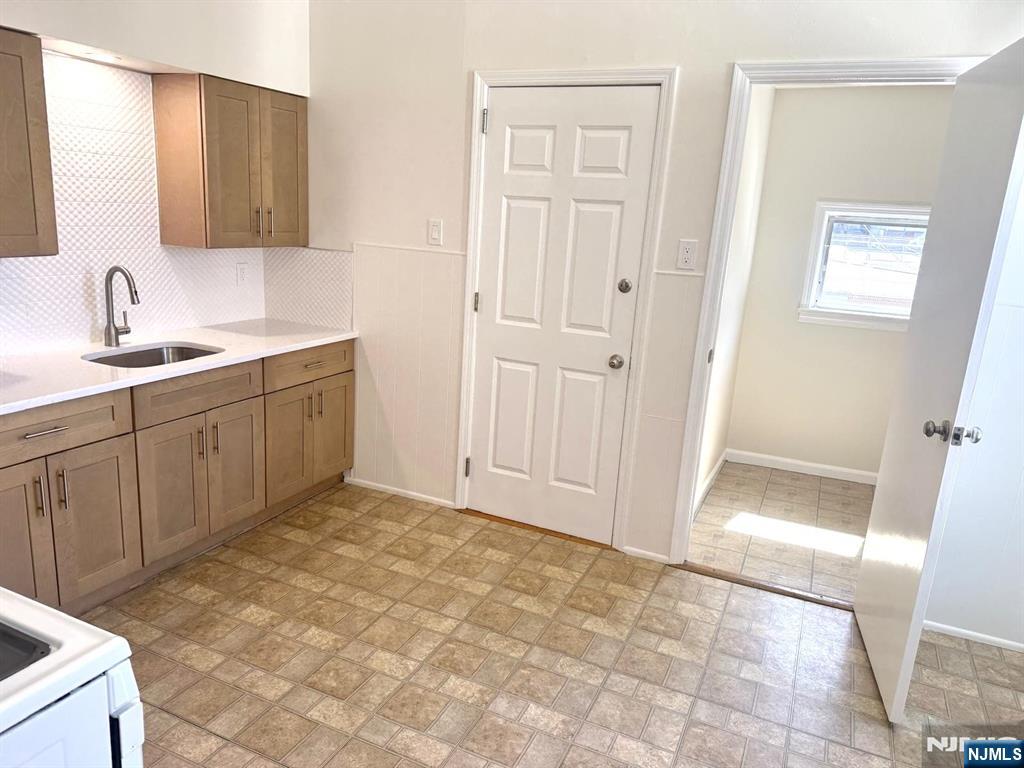 210-212 Maple Street, Unit 2 Kearny, NJ 07032 - Photo 3 of 9 a bathroom with a sink a vanity and a mirror