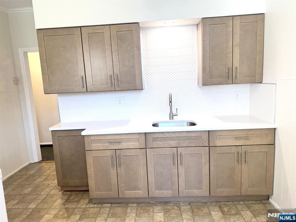 210-212 Maple Street, Unit 2 Kearny, NJ 07032 - Photo 4 of 9 a kitchen with a sink and cabinets