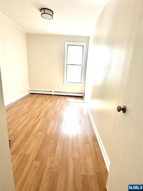 210-212 Maple Street, Unit 2 Kearny, NJ 07032 - Photo 7 of 9 a view of a room with wooden floor