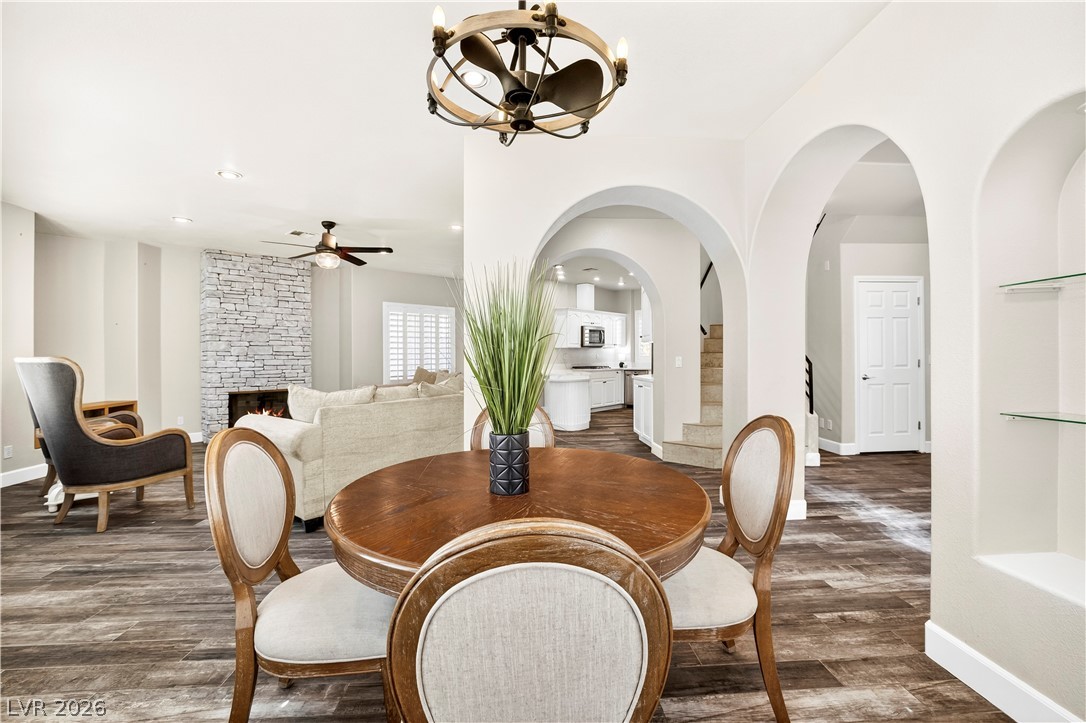 1135 Calico Ridge Drive Henderson, NV 89011 - Photo 83 of 86 An open floorplan seamlessly connects the dining area to the living room and kitchen, creating an inviting flow.