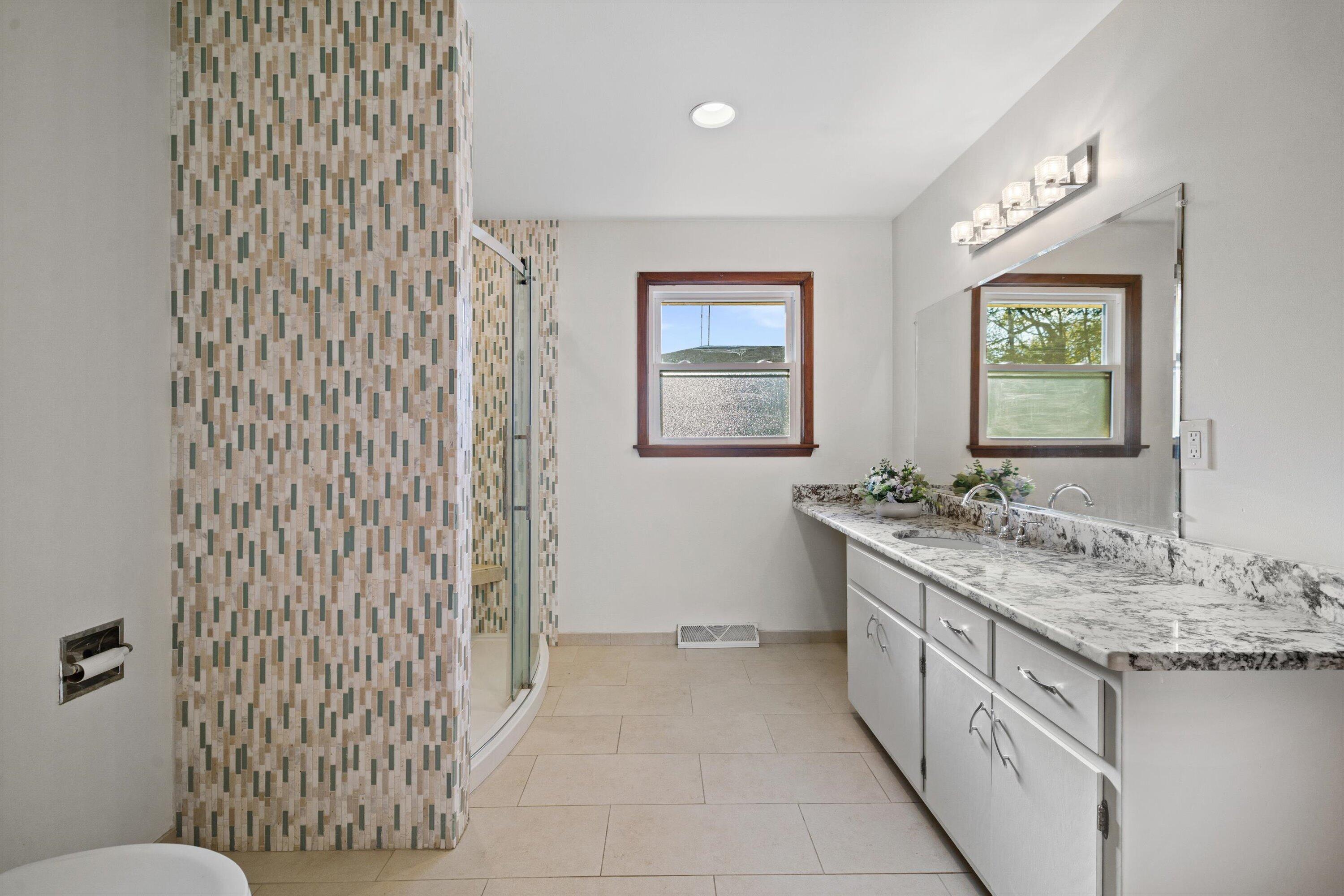 726 Royal Park Road Caledonia, WI 53402 - Photo 24 of 29 Full bathroom with a large vanity, modern lighting, and clean finishes offers both function and style