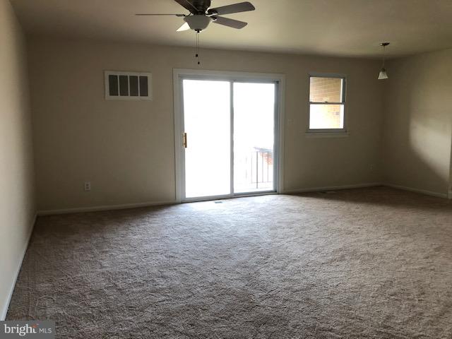 6427 Walther Avenue, Unit E Baltimore, MD 21206 - Photo 2 of 17 an empty room with windows