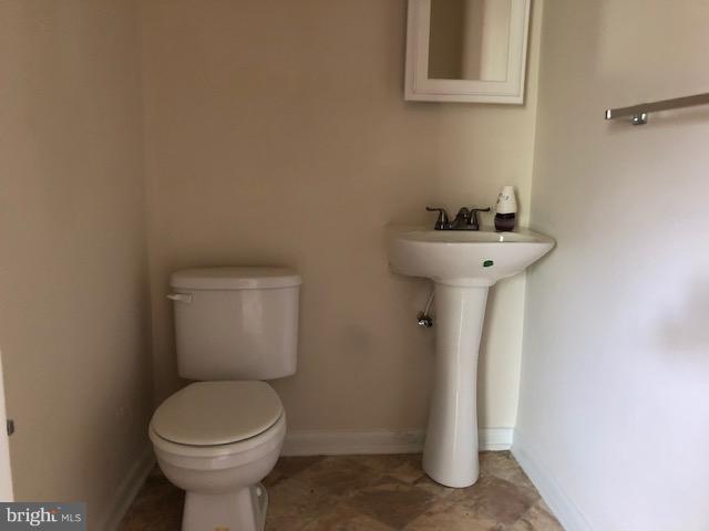 6427 Walther Avenue, Unit E Baltimore, MD 21206 - Photo 14 of 17 a bathroom with a sink and toilet
