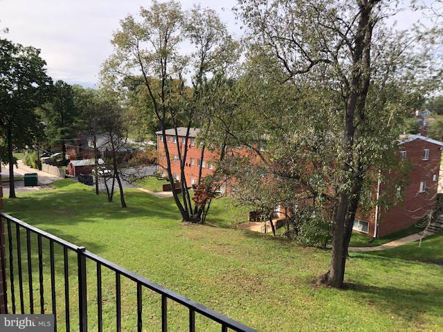 6427 Walther Avenue, Unit E Baltimore, MD 21206 - Photo 17 of 17 a view of a park with large trees