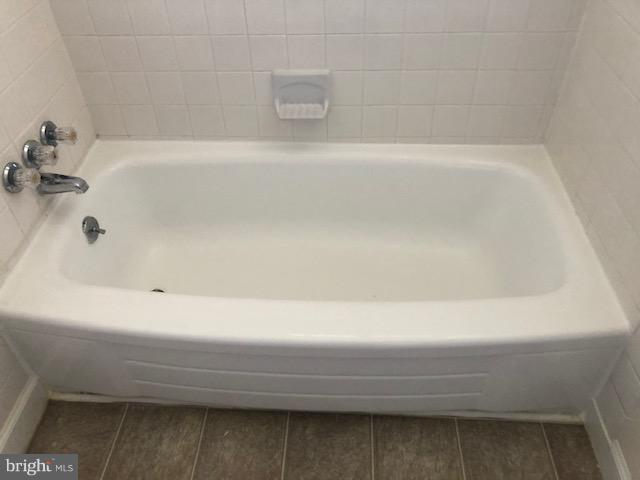 6427 Walther Avenue, Unit E Baltimore, MD 21206 - Photo 10 of 17 a bathroom with bathtub
