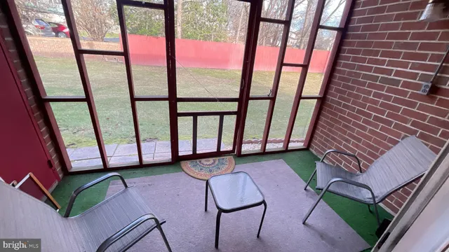a view of a porch with a bench
