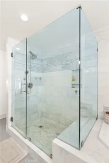 a bathroom with a shower and a sink