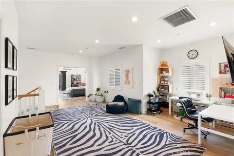 a bedroom with furniture and a window