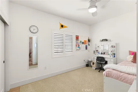 a bedroom with furniture and a window