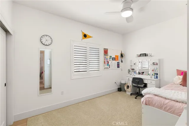 a bedroom with furniture and a window