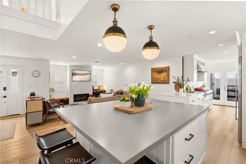 a living room with dining table and wooden floor