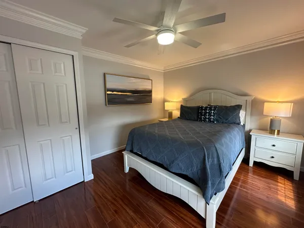 a bedroom with a bed and a chandelier