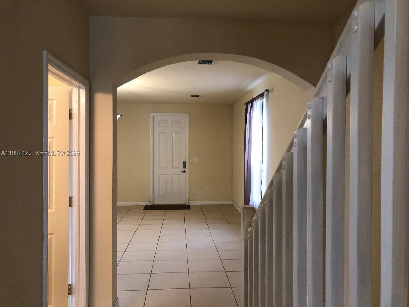 17000 Southwest 90th Terrace Miami, FL 33196 - Photo 35 of 56 a view of a hallway with entryway and window