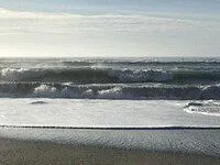 a view of a lake with a yard