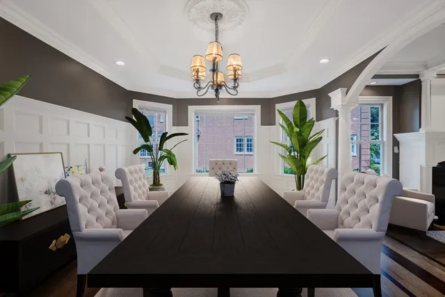a view of a dining room with furniture a chandelier and wooden floor