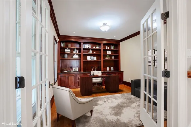 a room with furniture a rug and a book shelf