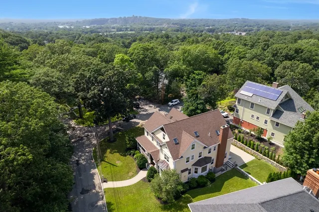 an aerial view of a house with a garden