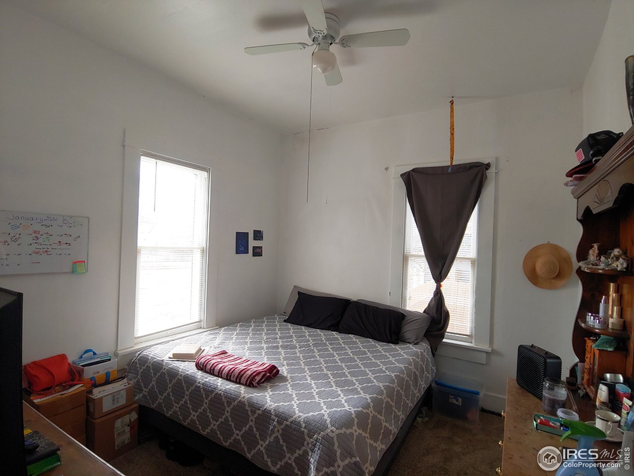 324 Platte Street Sterling, CO 80751 - Photo 11 of 18 a bedroom with a bed and a window