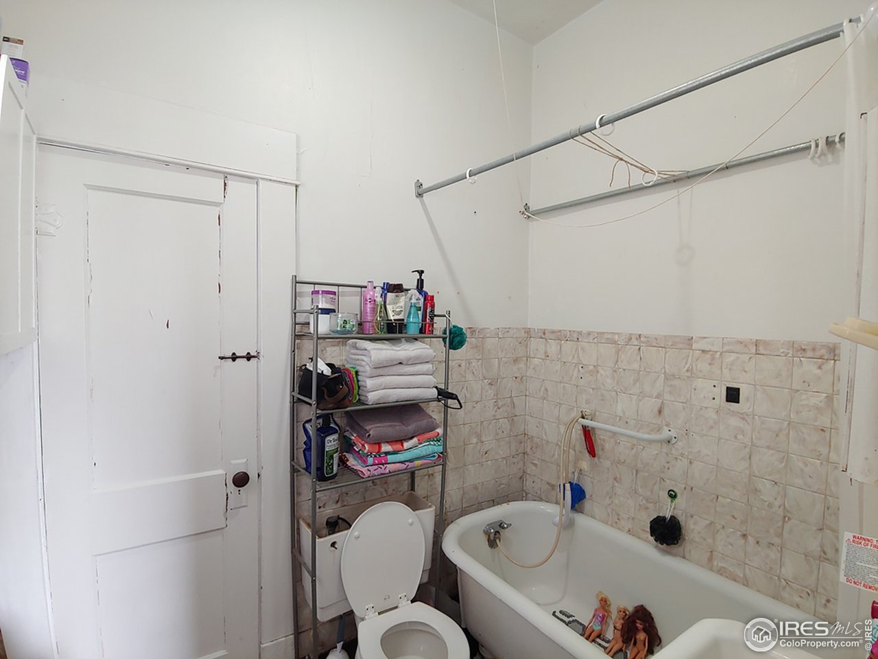 324 Platte Street Sterling, CO 80751 - Photo 14 of 18 a bathroom with a sink and a toilet