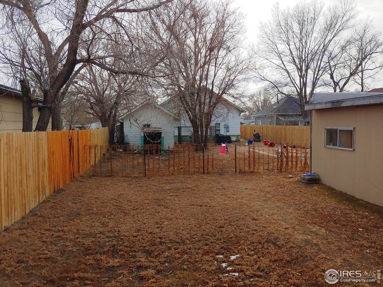324 Platte Street Sterling, CO 80751 - Photo 15 of 18 a view of a yard with a house