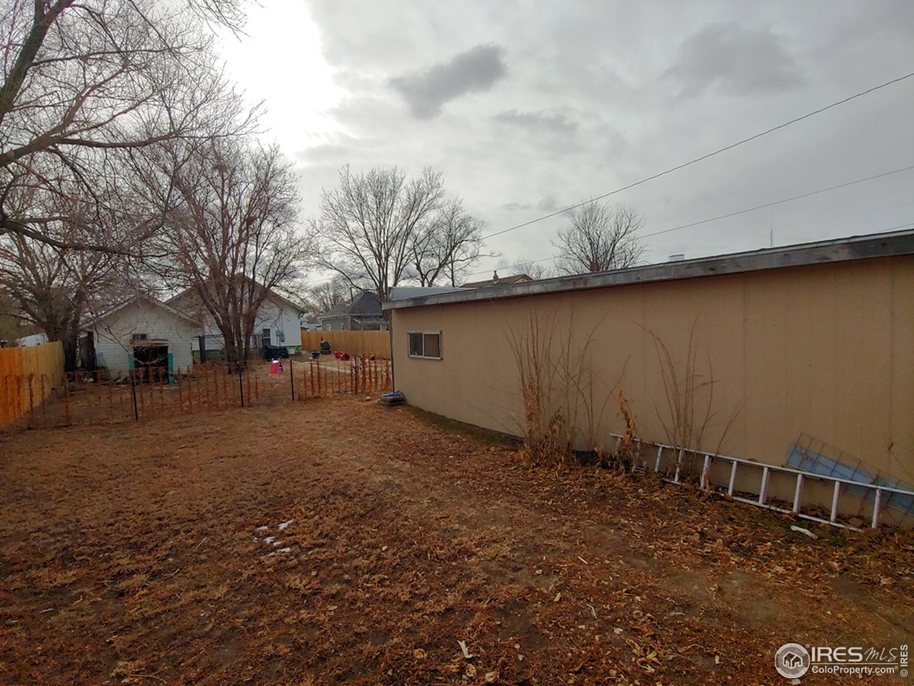 324 Platte Street Sterling, CO 80751 - Photo 18 of 18 a backyard of a house