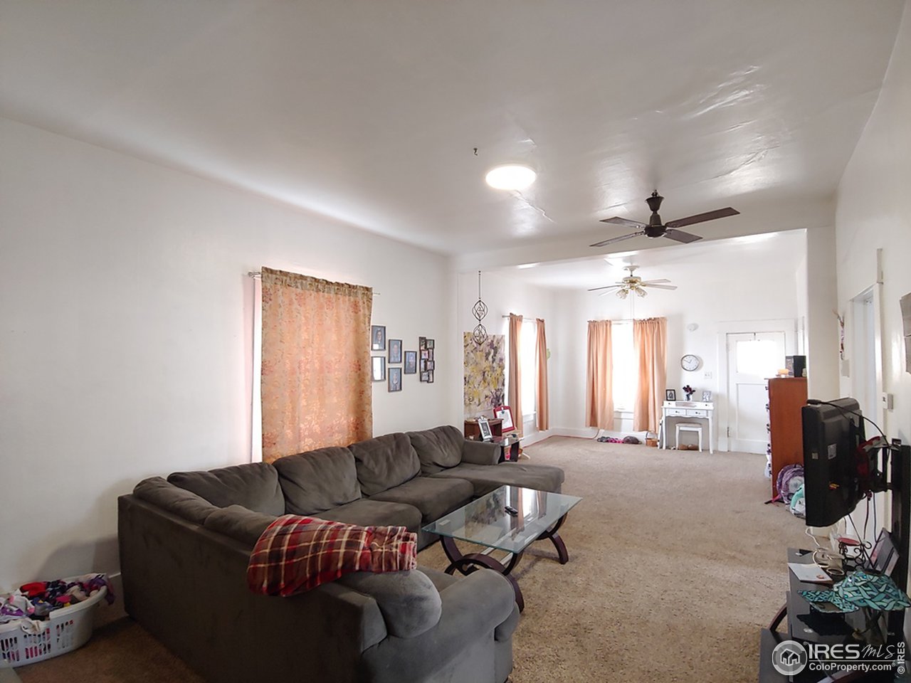 324 Platte Street Sterling, CO 80751 - Photo 4 of 18 a living room with furniture window and a table